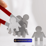 Hand holding a red magnet attracting small human-shaped figures, representing lead generation and client attraction.