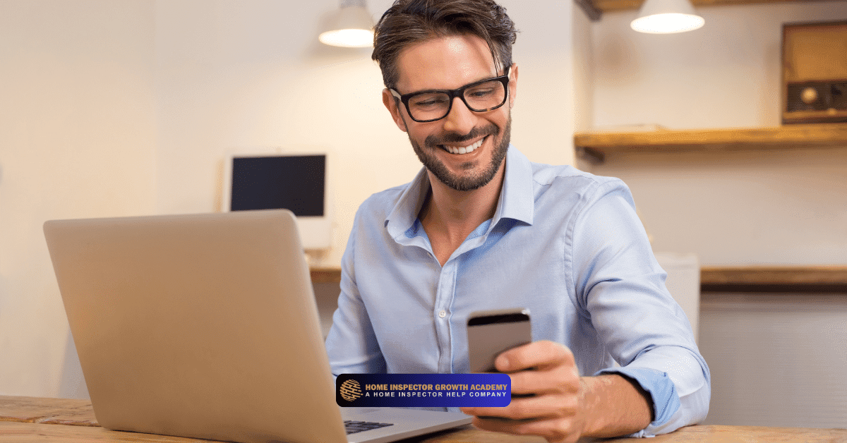 Smiling professional using a smartphone and laptop to manage home inspection leads and client communication